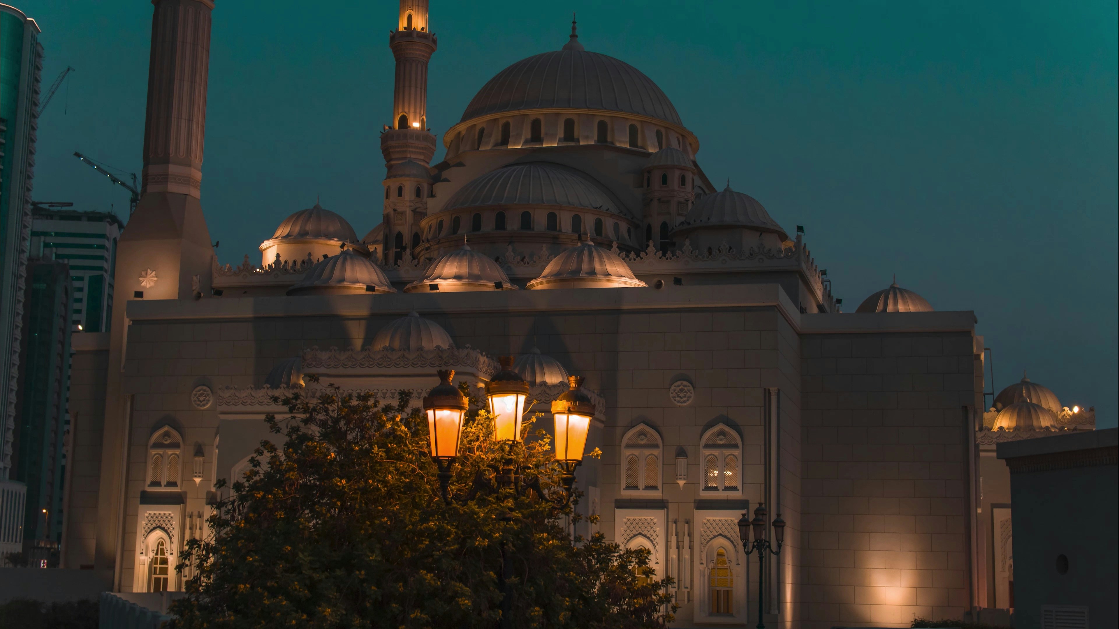 a large white building with a clock on it's side