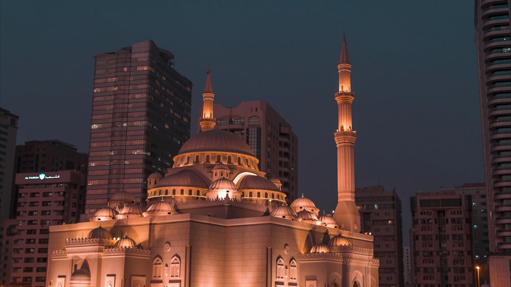 a large building with two towers in the middle of a city