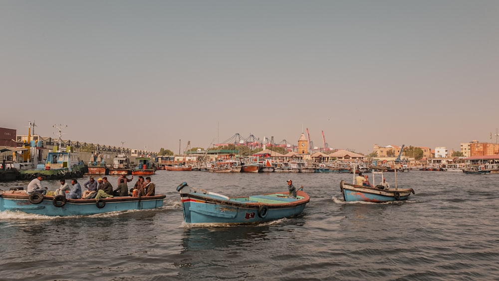 a group of people on small boats in the water