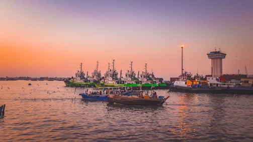 Sunset view of multiple vessels anchored near the Guyana coastline.