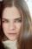 a woman with long hair and blue eyes