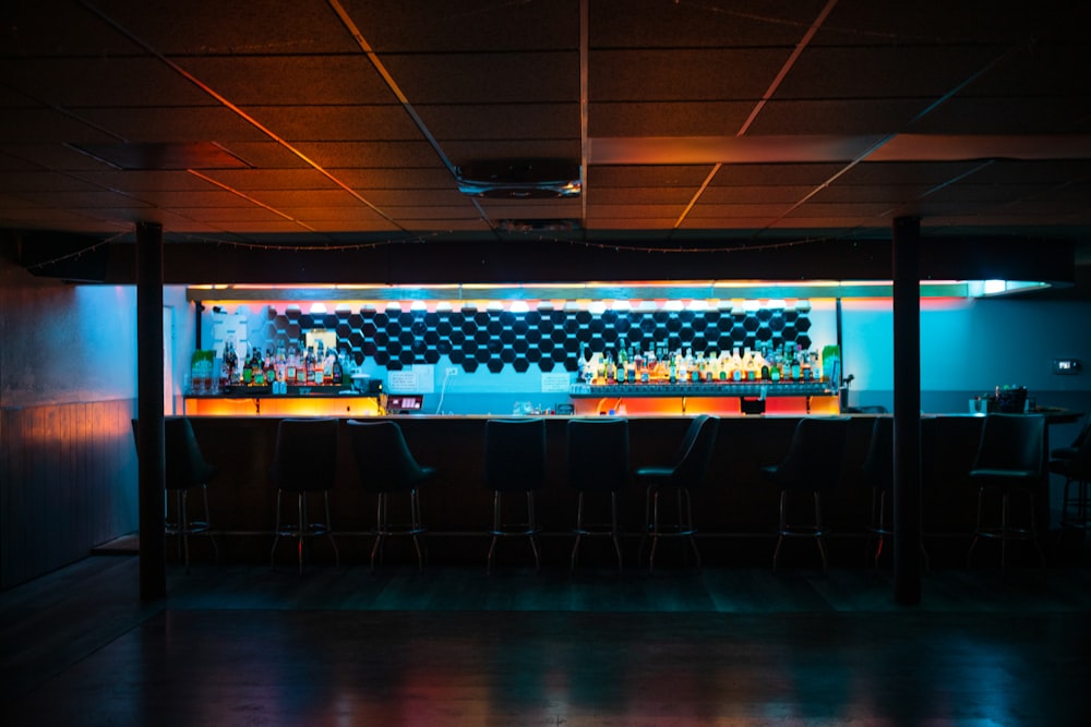 a dimly lit bar in a dimly lit room