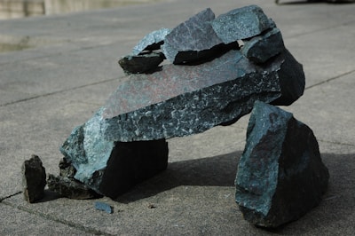 Stone and marble fragments arranged into a sculptural composition with rough and smooth contrasts.