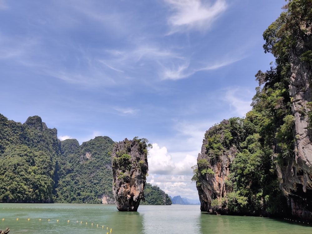 a body of water surrounded by mountains and trees