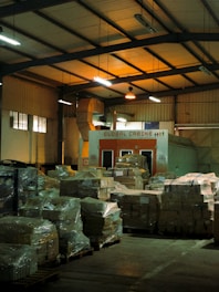 a warehouse filled with lots of boxes and pallets