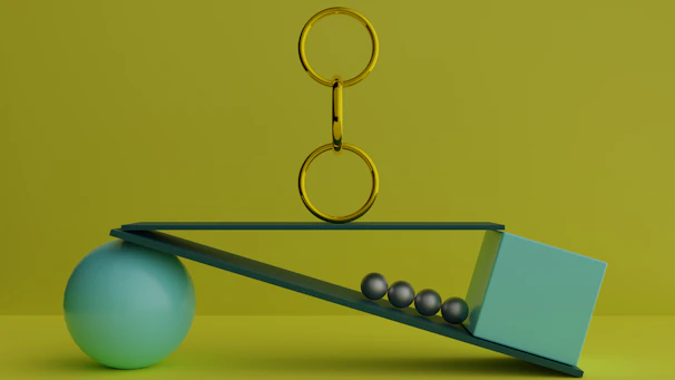 a ball and a pair of scissors on a scale
