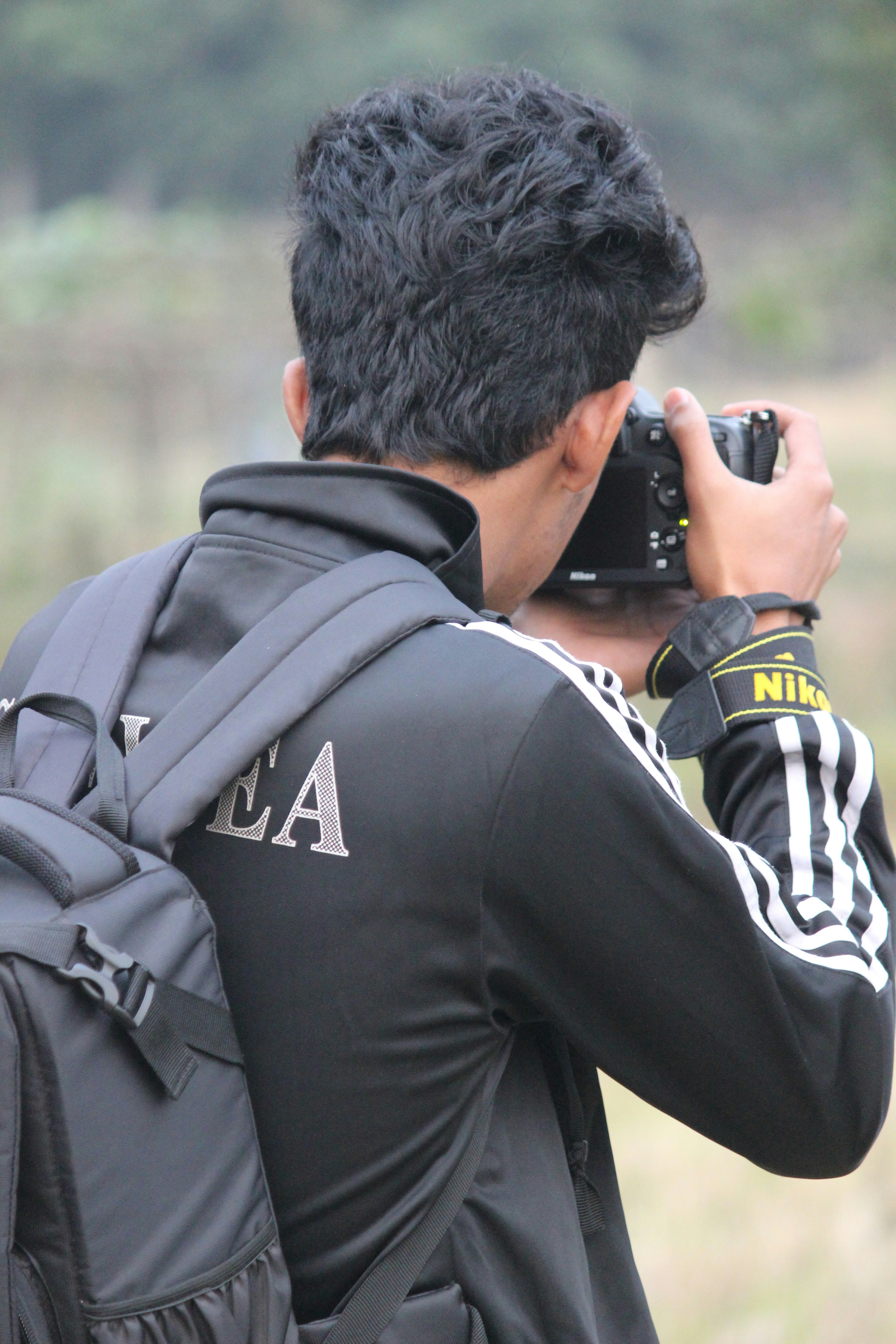 a man taking a picture with a camera
