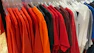 a rack of shirts hanging in a store