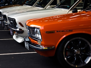 a row of parked cars in a parking lot