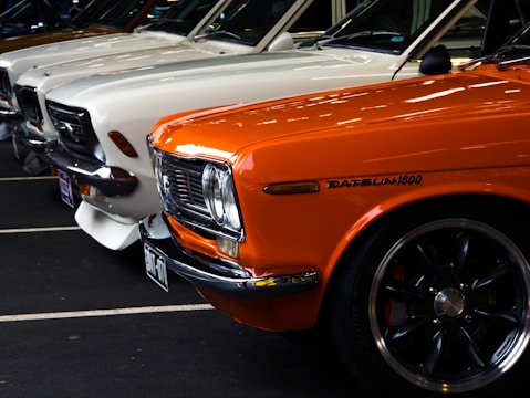 a row of parked cars in a parking lot
