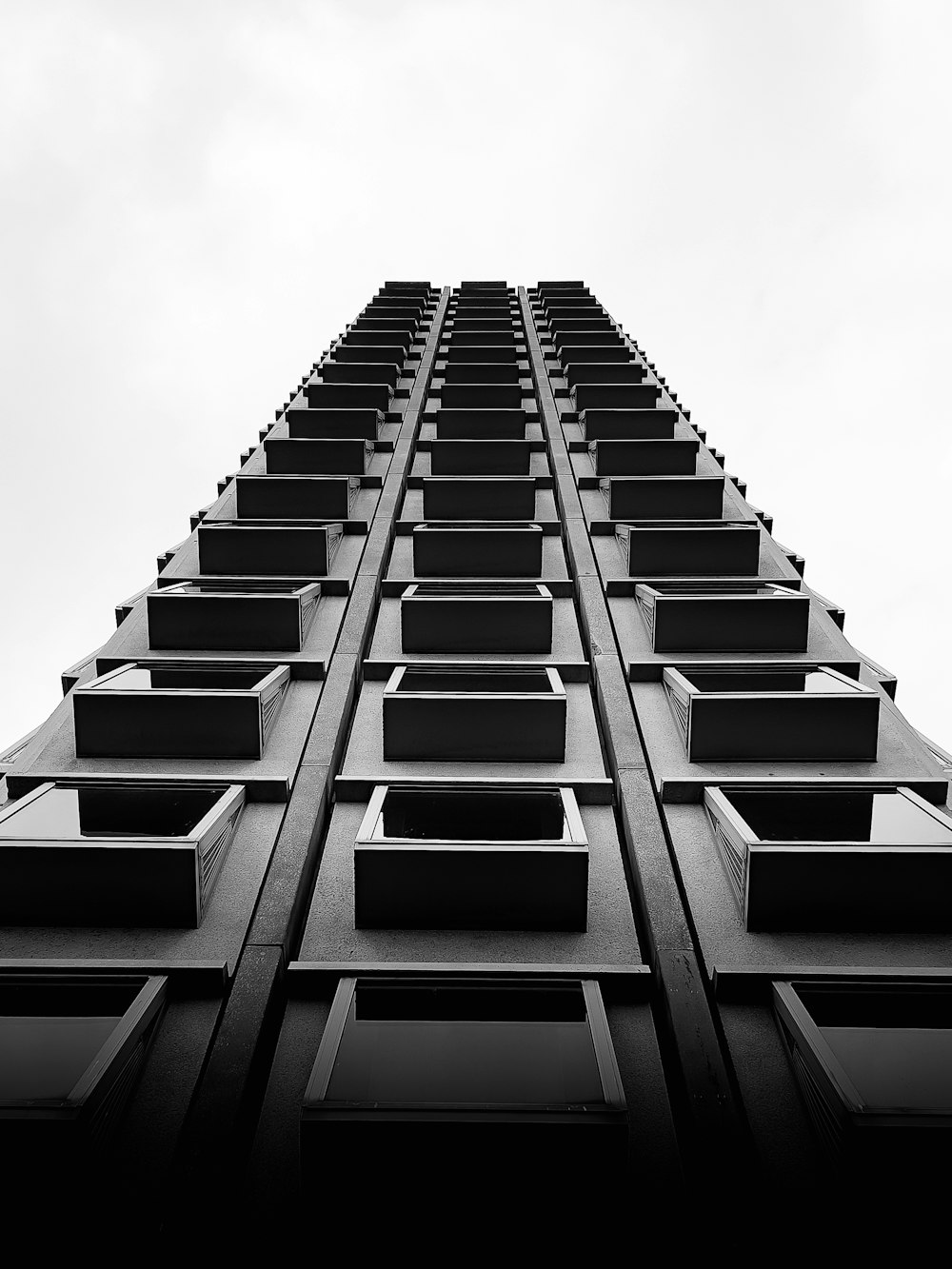 a black and white photo of a tall building