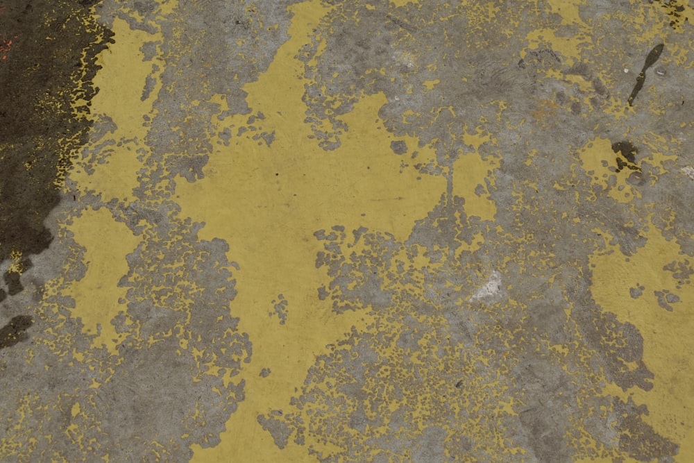 a close up of a yellow and gray surface