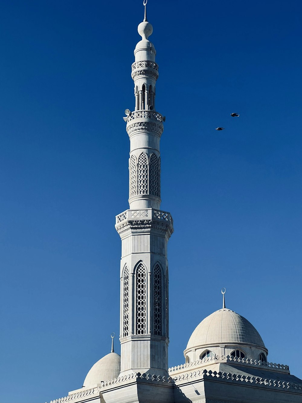 a large white building with a tall tower