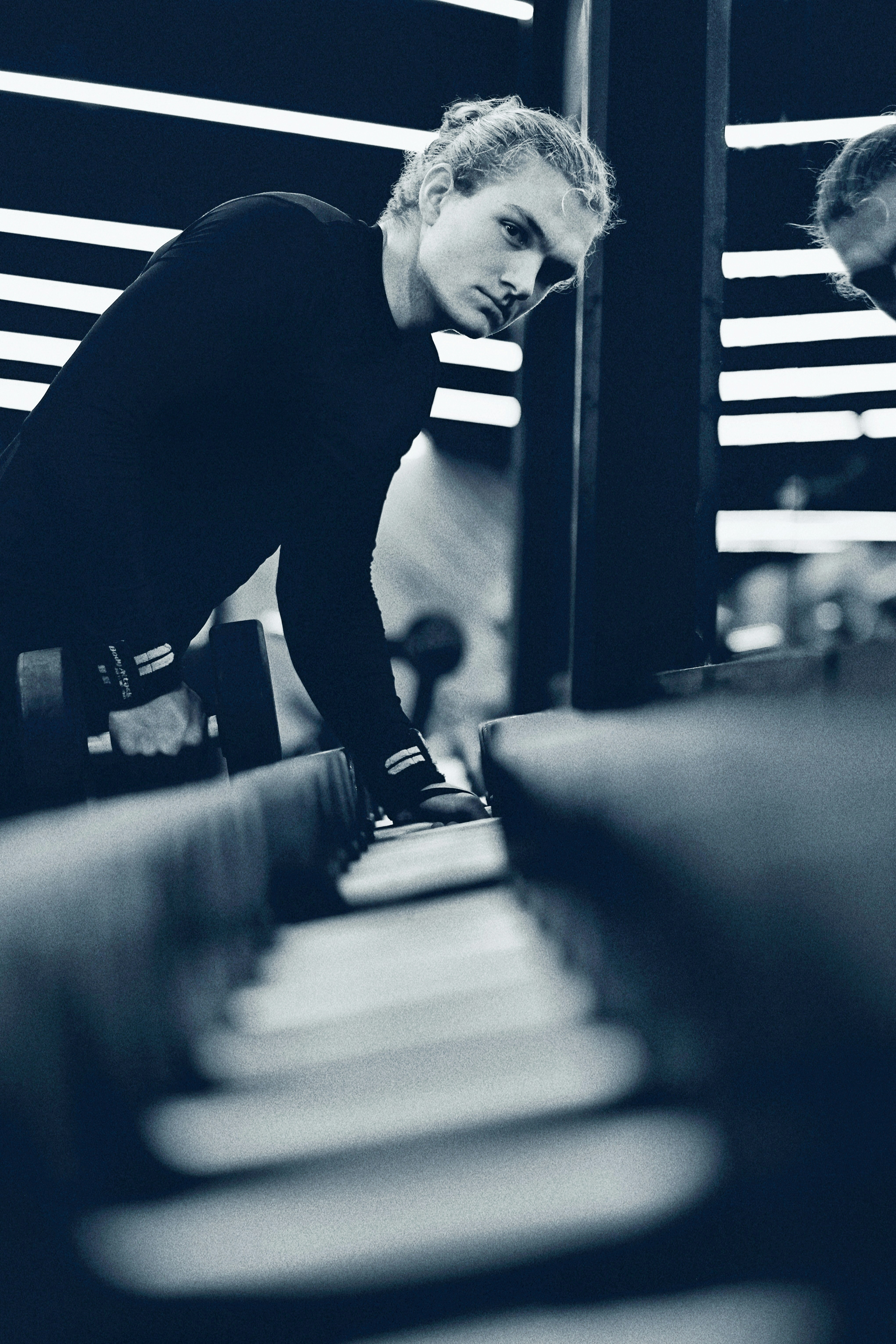 a man standing in front of a computer keyboard
