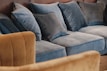 Soft cushions and throws arranged on a cozy sofa