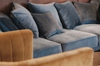 Soft cushions and throws arranged on a cozy sofa
