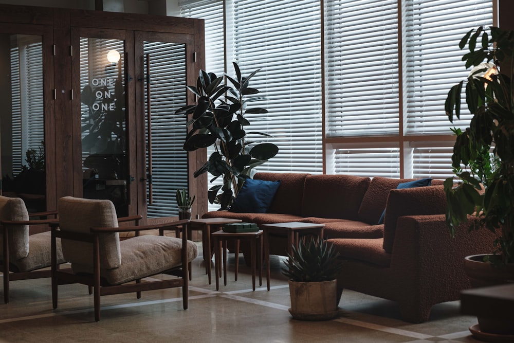 a living room filled with furniture and a large window