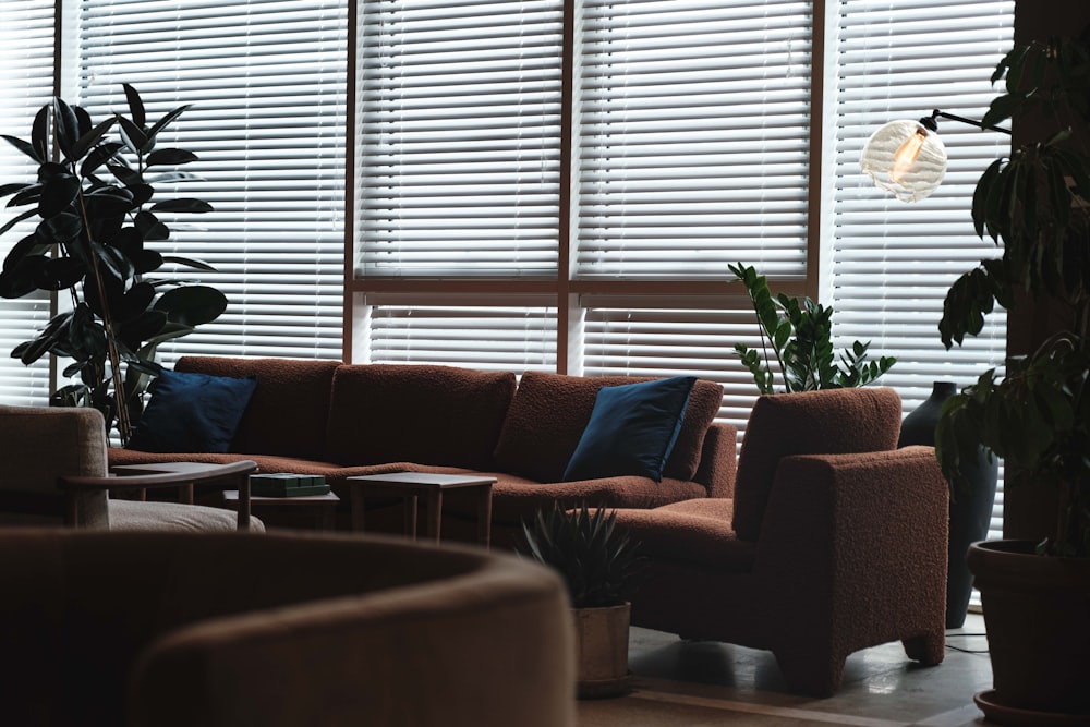 a living room filled with furniture and a large window