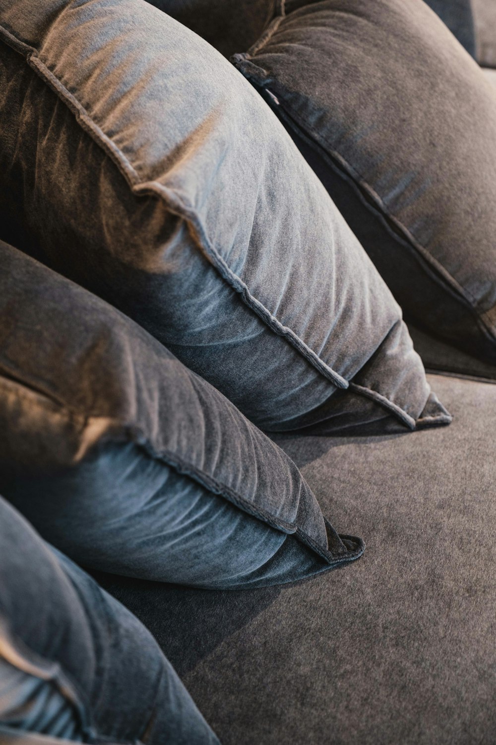 a close up of pillows on a couch