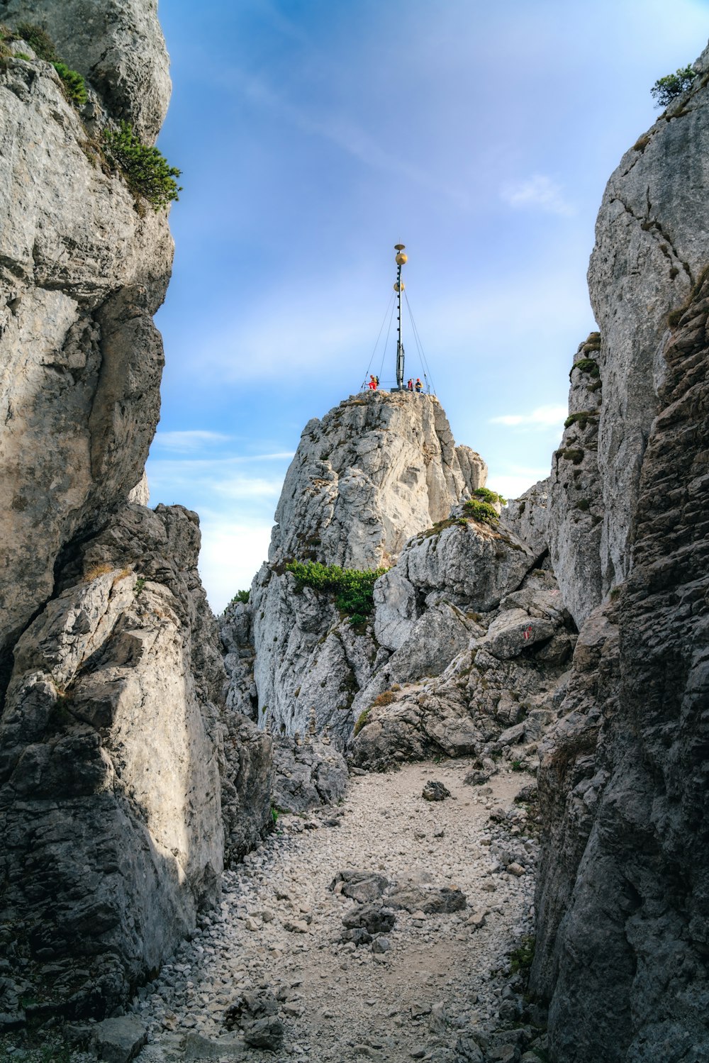 a person standing on top of a rock formation