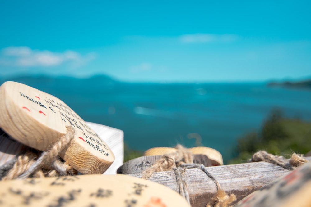 a close up of a piece of wood with a blue sky in the background