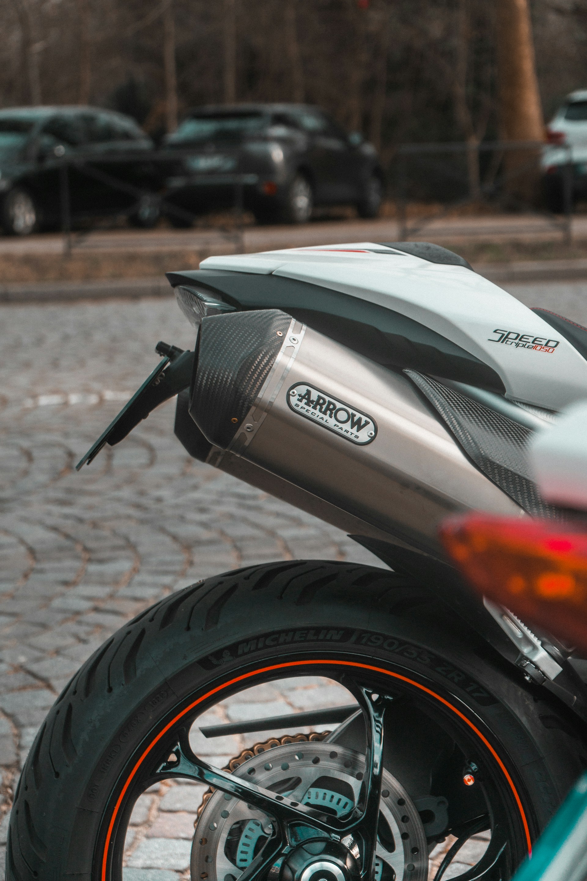 a close up of a motorcycle parked on a street