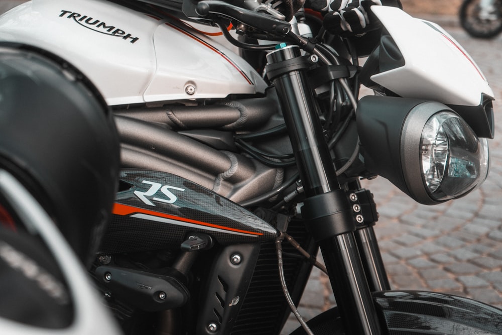 a close up of a motorcycle parked on a street