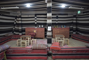 Seating area with traditional Indonesian artwork on the walls.