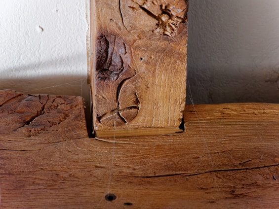 Close-up of a wooden beam treated with Westford Termite Killer, showing its smooth, protected surface.