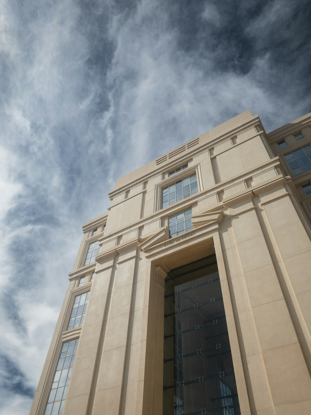 a tall building with a sky background