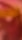 A blurred image with a mix of warm colors such as pink, orange, and red, creating an abstract appearance.