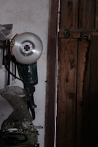 Close-up of a craftsman sharpening a bandsaw blade in a workshop