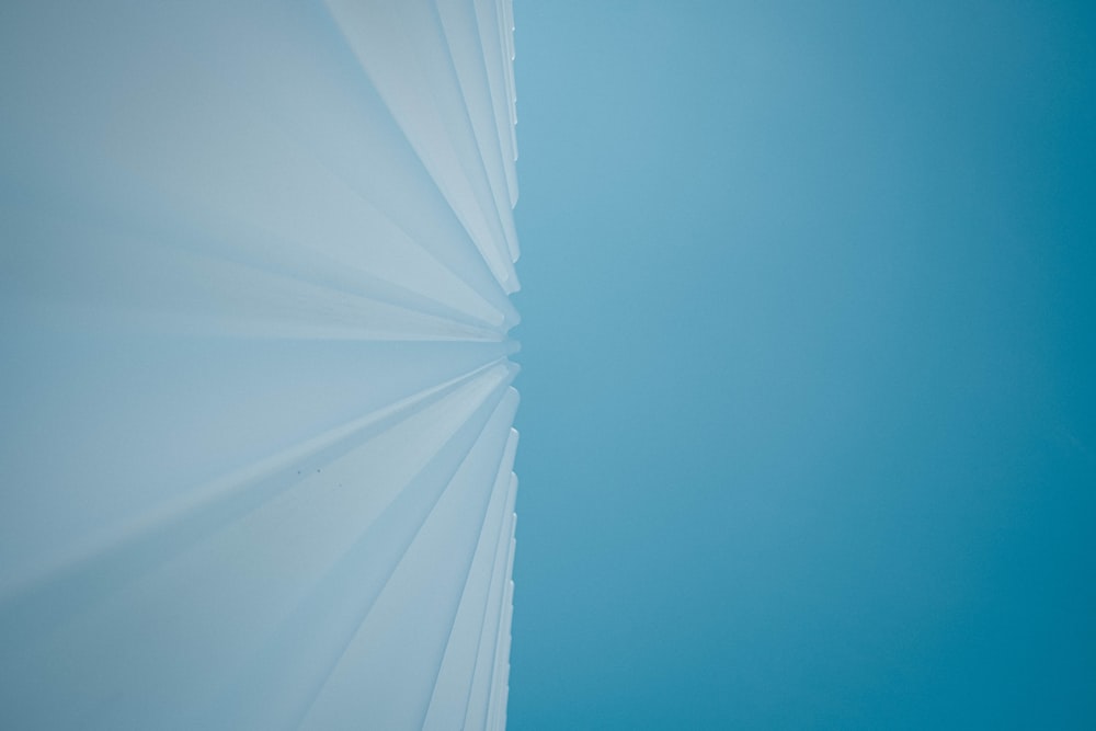 a view of the sky from the bottom of a building