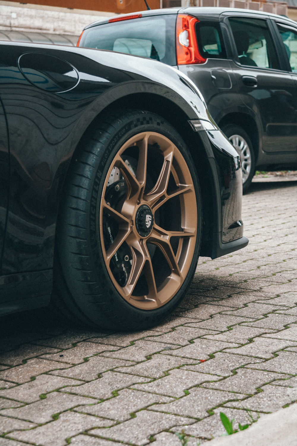 a close up of a car parked on a street