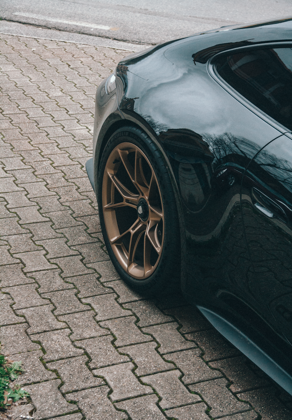 a black sports car parked on the side of the road