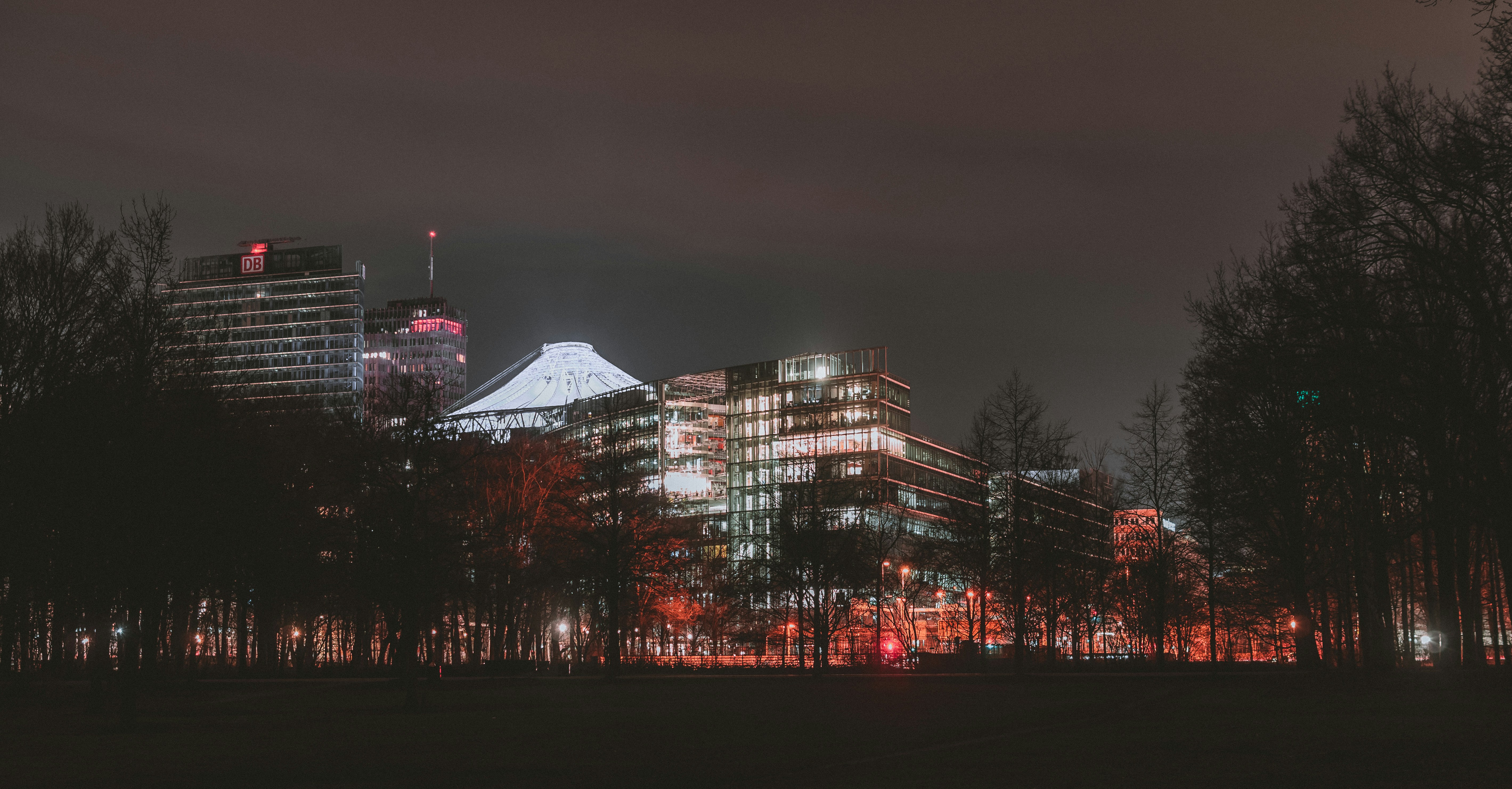 a night view of a city with tall buildings