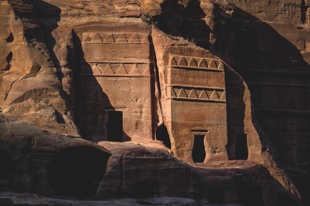 a building carved into the side of a mountain