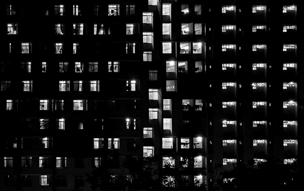 a black and white photo of a building at night