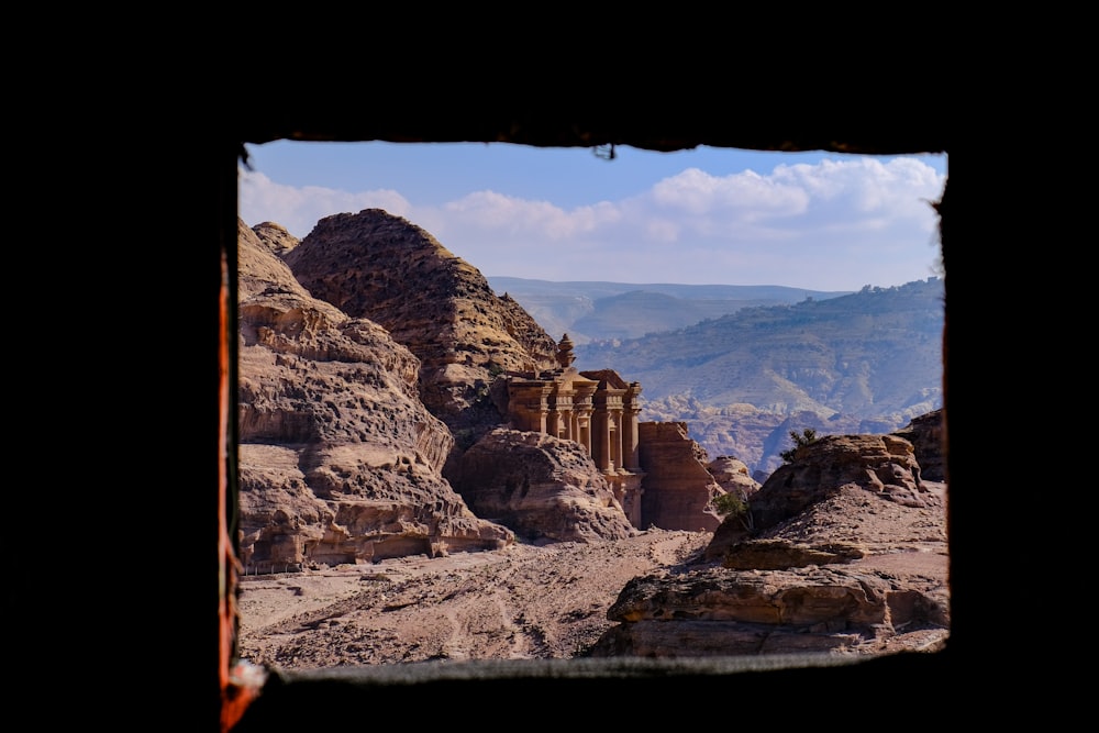 a view of the mountains from a window in a building