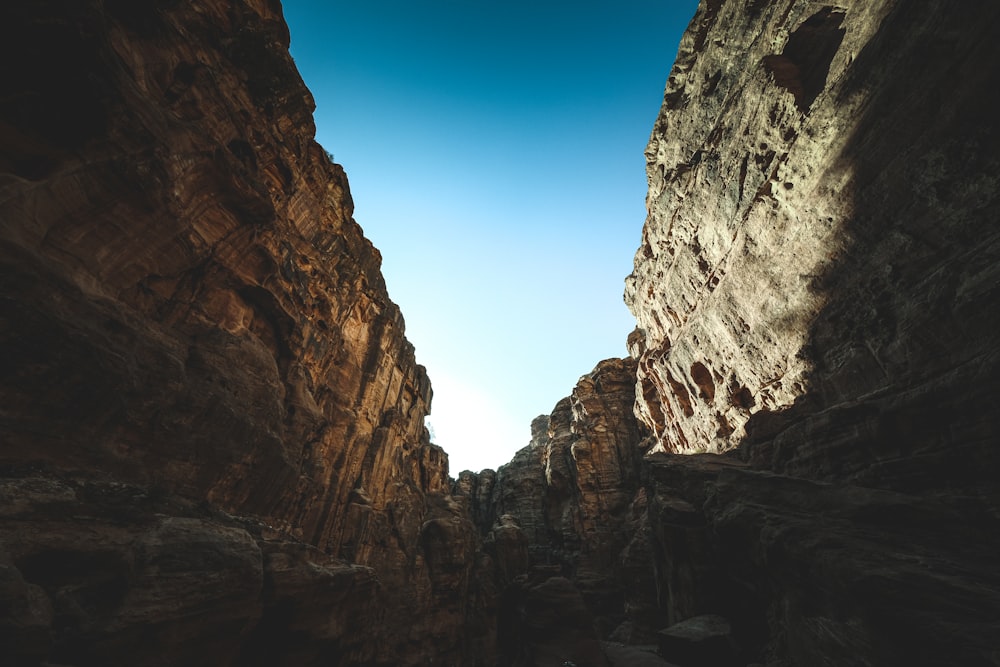 a narrow canyon with a sky in the background