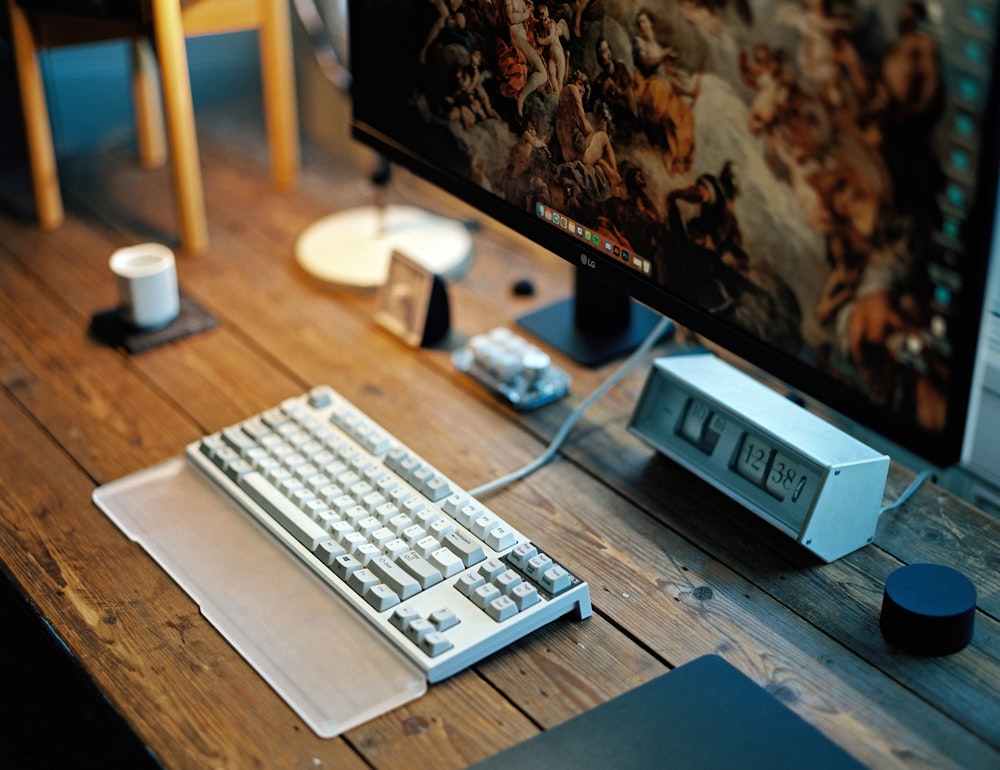 a desktop computer sitting on top of a wooden desk