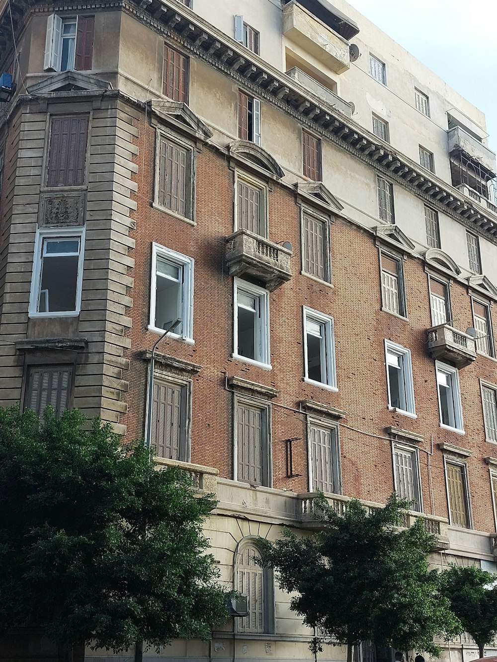 a tall brick building with lots of windows