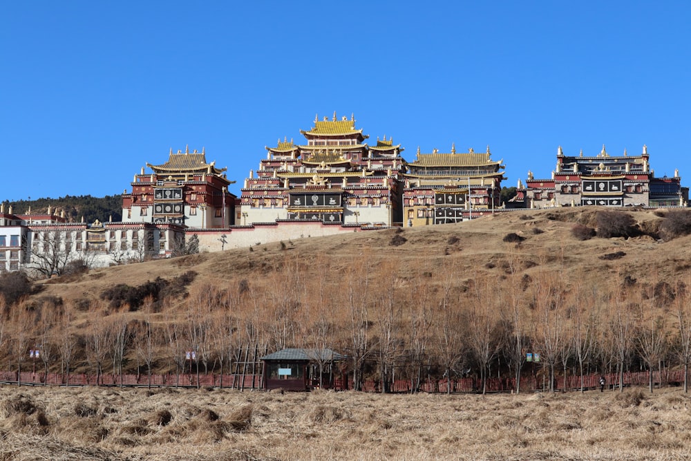 a group of buildings sitting on top of a hill