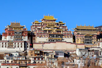 a group of buildings with a sky background