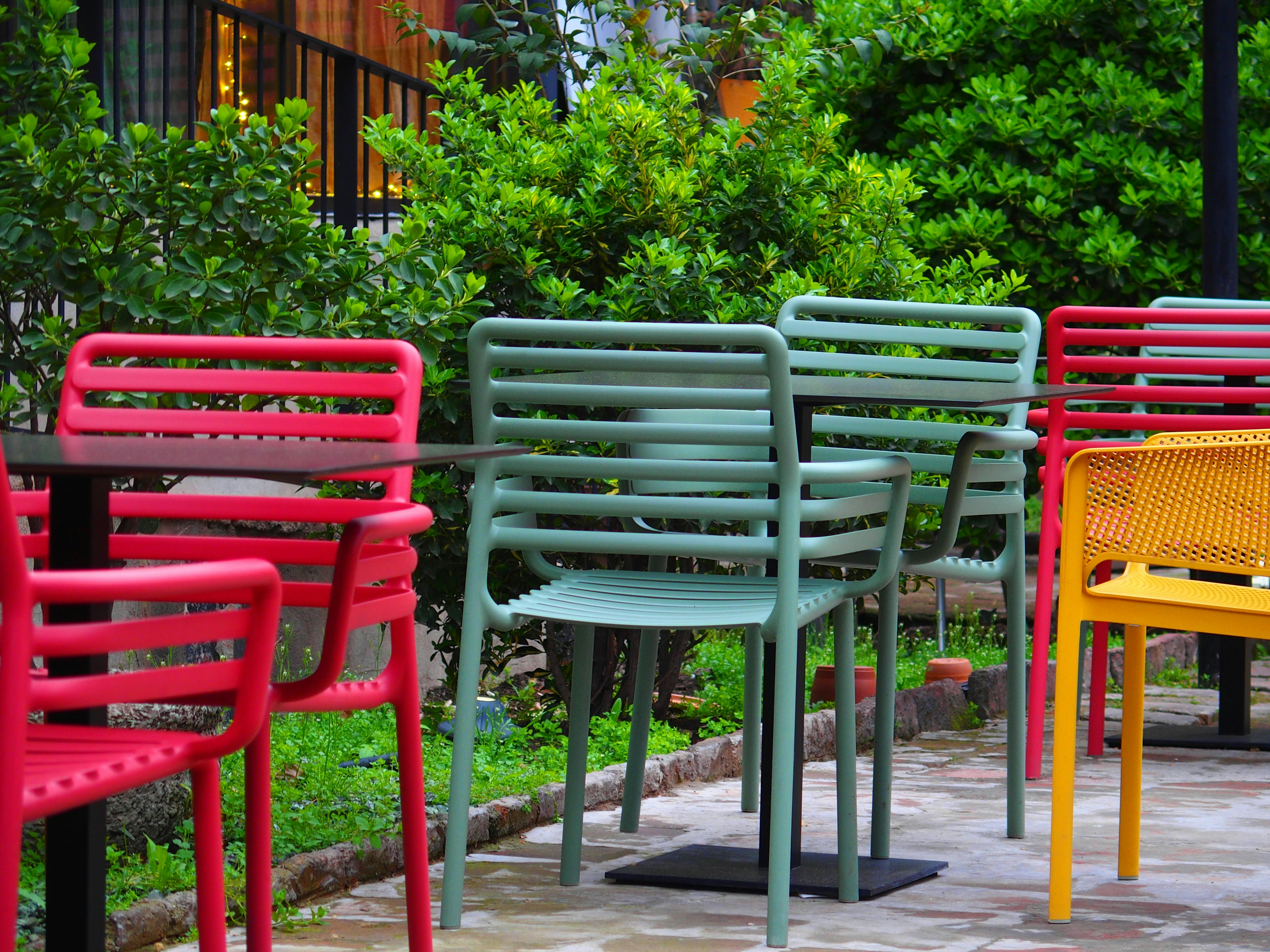 a row of colorful chairs sitting next to each other