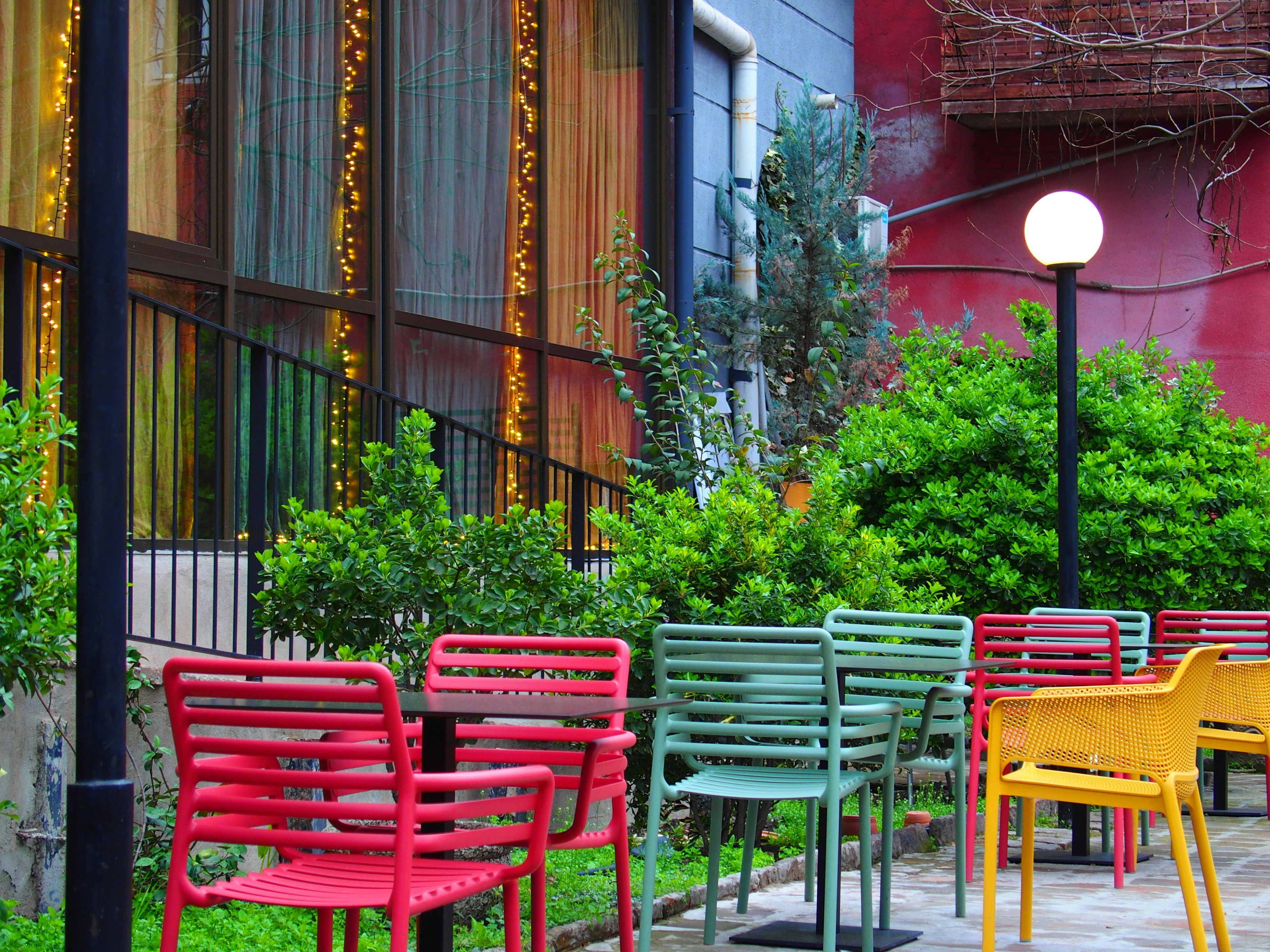 a row of colorful chairs sitting next to each other