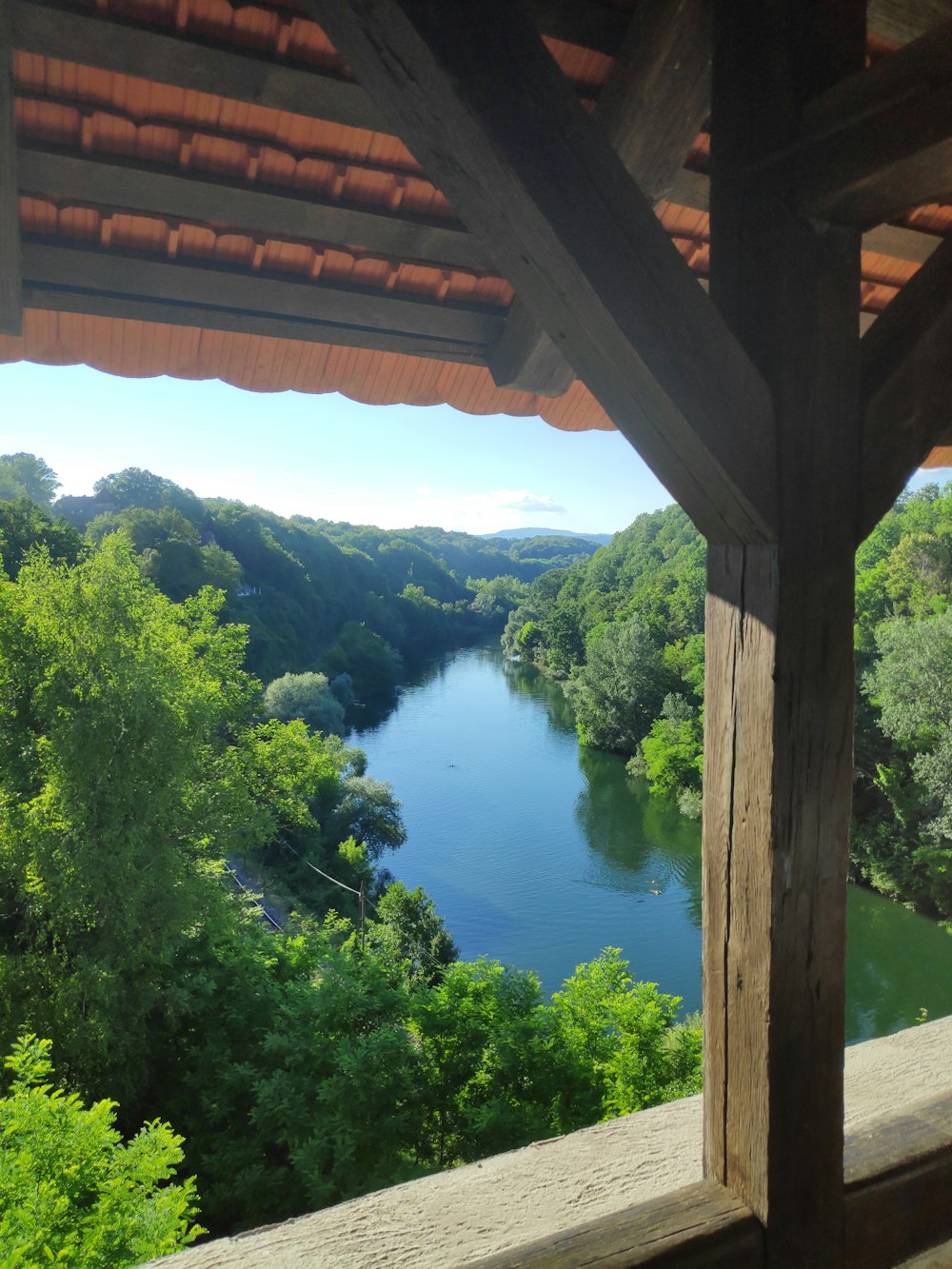 a view of a body of water from a covered area