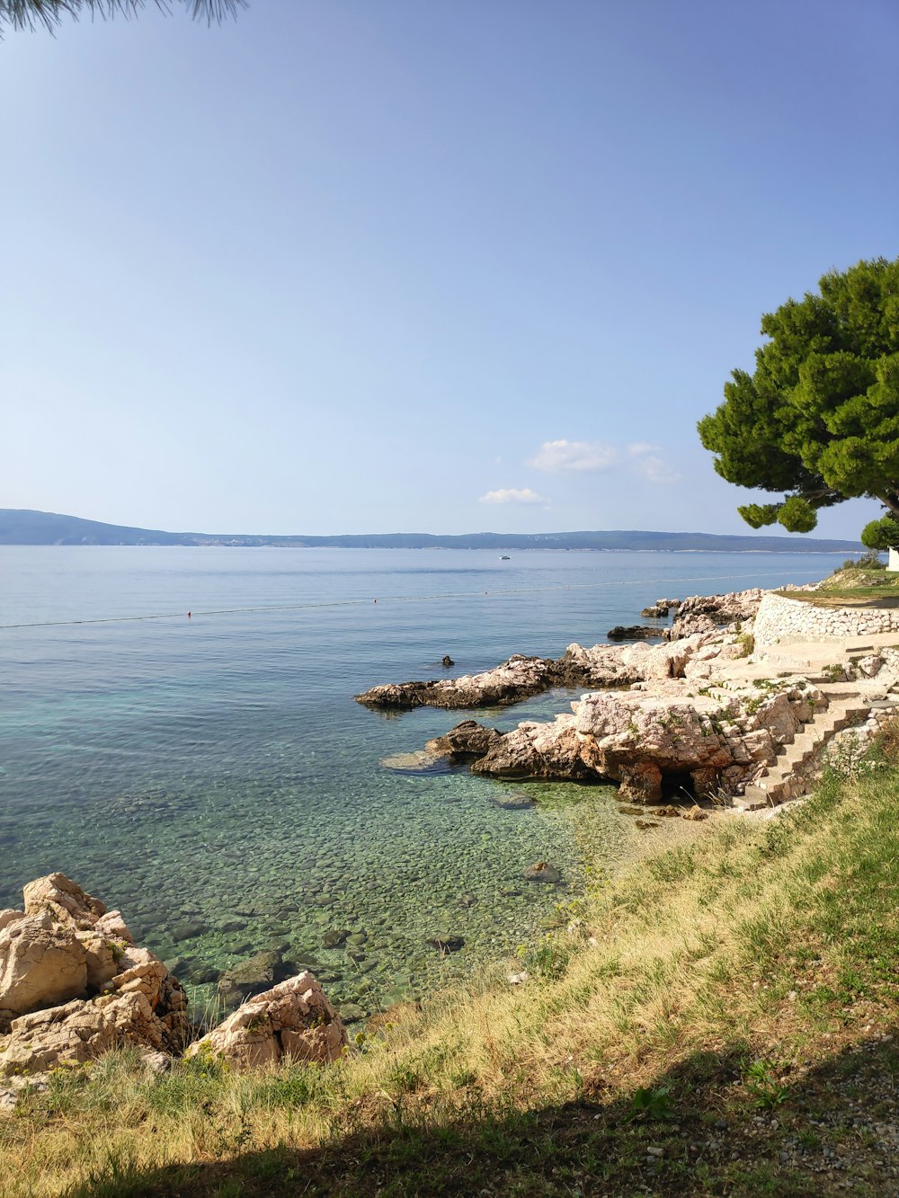 a view of the ocean from the shore of a beach