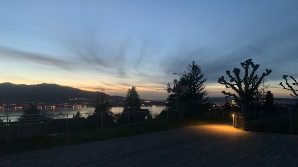 A peaceful nature scene at dusk, symbolizing the transition to restful nighttime and recovery.