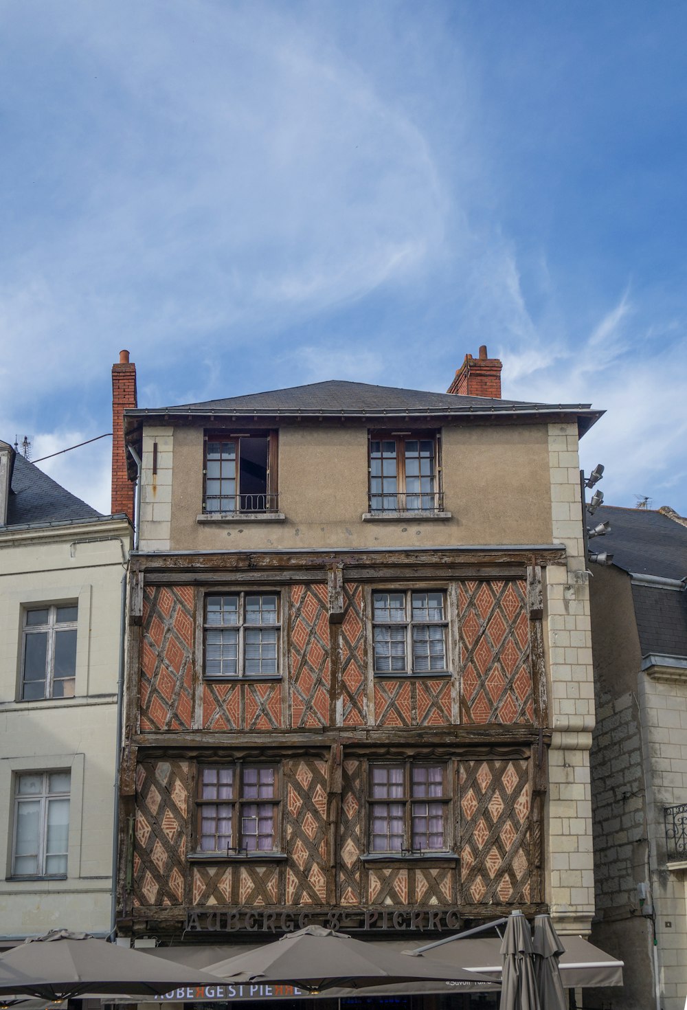 an old building with a clock on the front of it